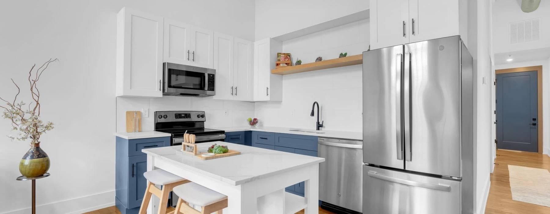 a kitchen with white cabinets