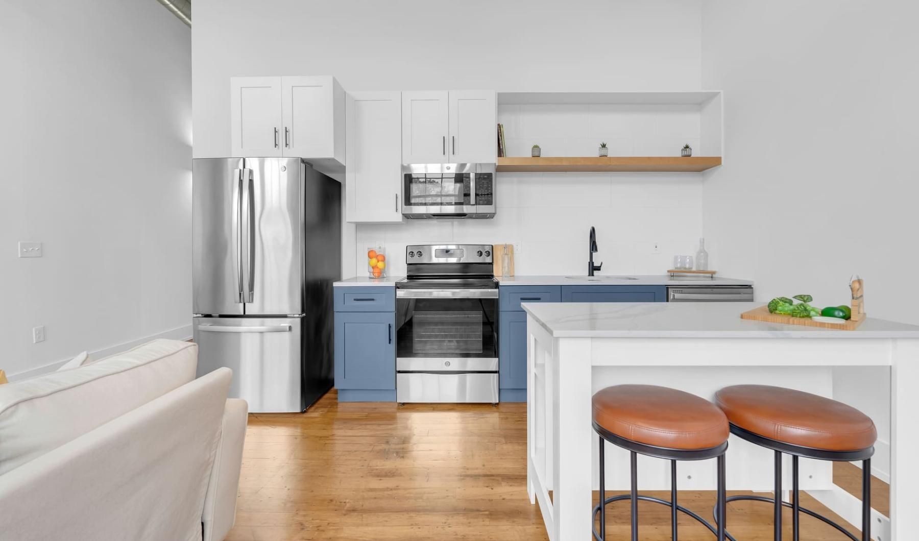 a kitchen with a bar stool and a table