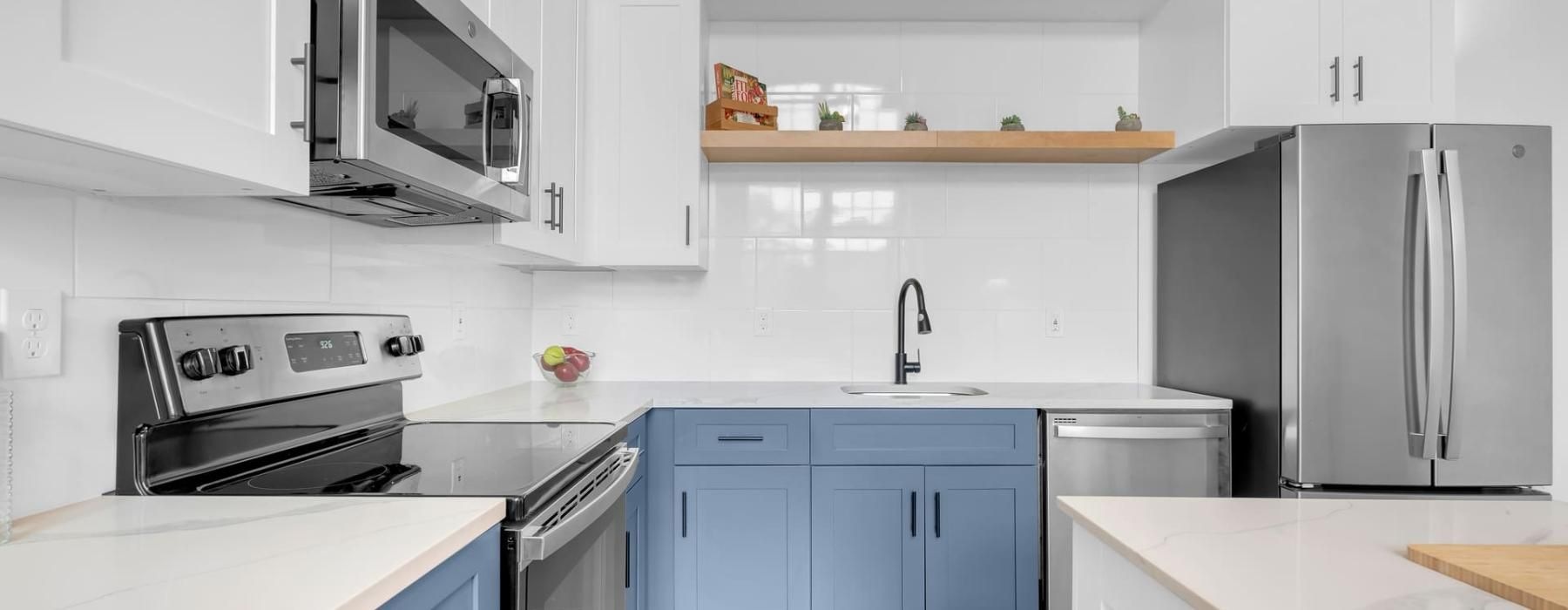 a kitchen with white cabinets