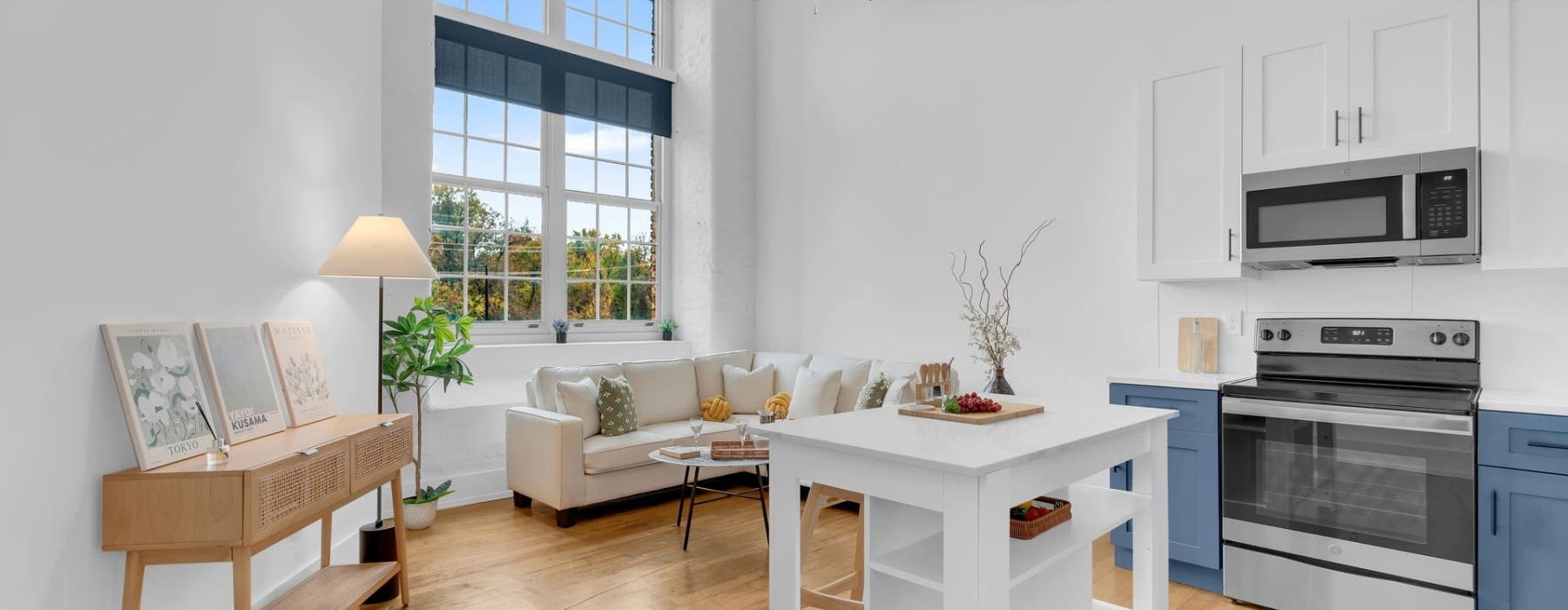 a living room with a white couch and a table
