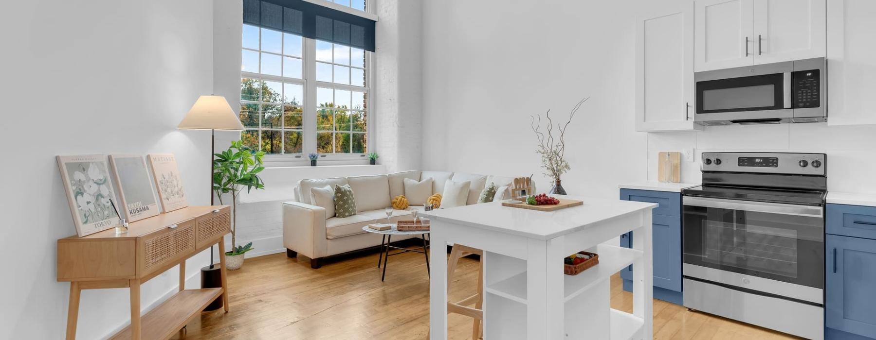 a living room with a white couch and a table